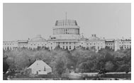 Water-filled canal in front of partially-constructed Capitol building