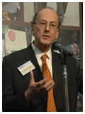 Dr. Glass speaking in front of the exhibition at the opening