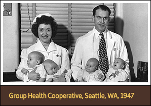 White male doctor and female nurse holding two White babies each and looking at viewer.