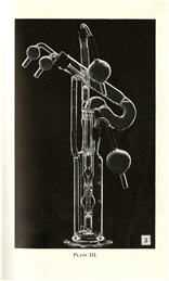 Tall, narrow, glass instrument with curved, cylindrical pipes and valves.