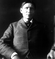 Seated frontal view of Charles A. Eastman, 1913 Photographic reproduction: From collections of the National Anthropological Archives, Smithsonian Institution. Photo no. 3462-a.