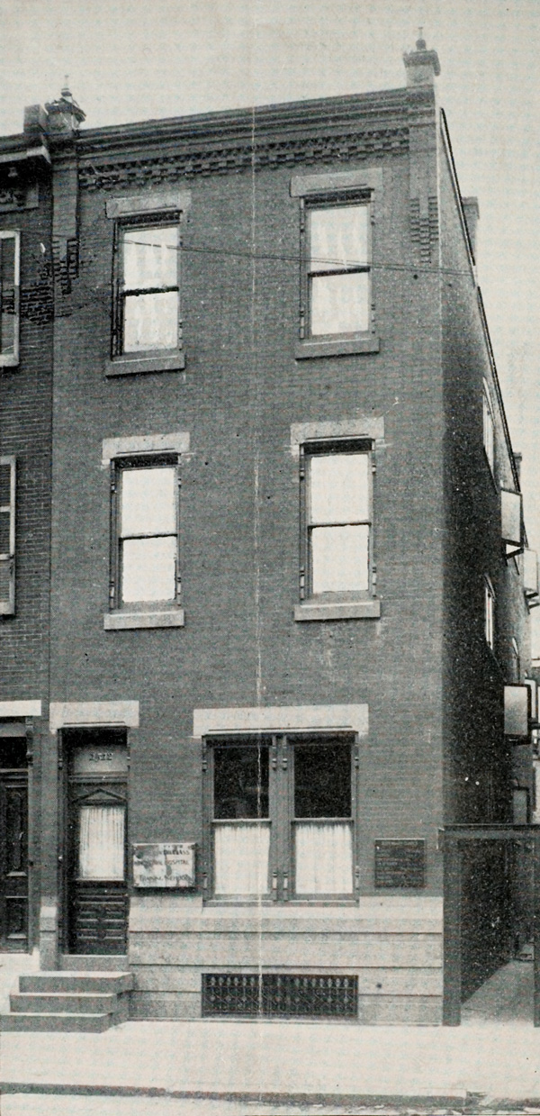 Exterior of two-story brick building.