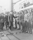 Three Public Health Service's Division of Foreign Quarantine medical officers inspect the crews of a cargo vessels from foreign port.