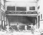 The foreman of a ratproofing crew in New Orleans, Louisiana, pointing out the progress of the work to Public Health Service officer Dr. Charles V. Aiken