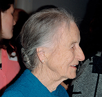 Dr. Leila Daughtry Denmark, a side profile view of an  elderly White female in a blue jacket.