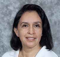 Dr. Melvina L. McCabe, a White female with dark hair posing for her portrait.