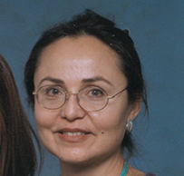 Dr. Kathryn Ann Morsea, an American Indian female posing on the right with her daughter (left) and a baby (center).