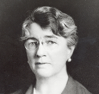 Dr. Louise Pearce, a White female in a blouse posing for her portrait.