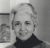 Dr. Rachel Naomi Remen, a female with short hair wearing a turtleneck sweater posing for her portrait.