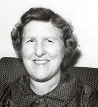 Dr. Marian Wilkins Ropes, a White female in a collared blouse smiling for her portrait.