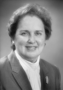 Dr. Ethel Schwartz Weinberg, a White female in a suit smiling for her portrait.