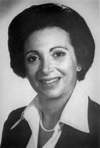 Dr. Nanette Kass Wenger, a White female with short hair in a collared blouse posing for her portrait.