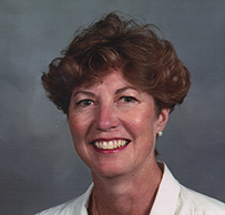 Dr. Catherine Gail Kincaid, a White female with short hair smiling for her portrait.