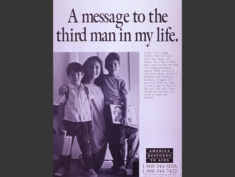 A woman stands with two boys