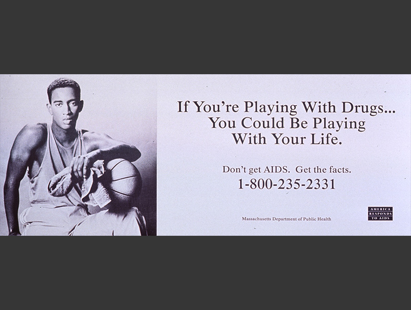 A portrait of an African American man holding a basketball