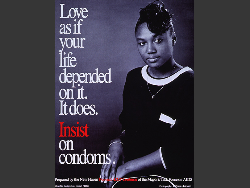 Black and white photograph of an African American woman sitting down and looking at the viewer.