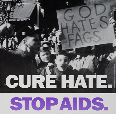 Color photograph of a group of demonstrators, one holding a sign, whose faces are blurred.   