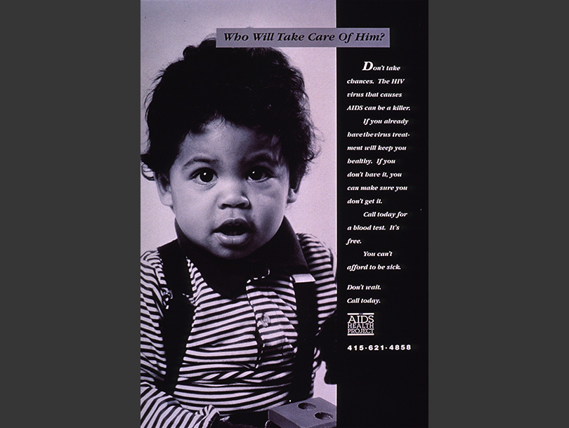 Black and white photograph of a toddler looking at the viewer holding a toy.   