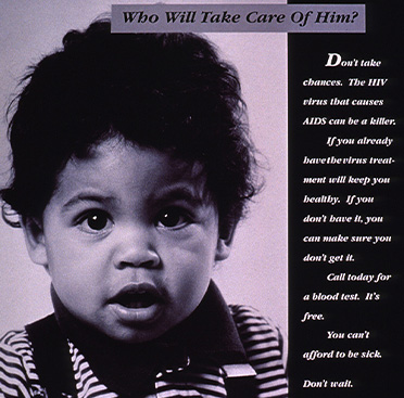 Black and white photograph of a toddler looking at the viewer holding a toy.   