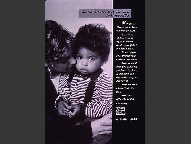 Black and white photograph of a white woman holding a toddler, the toddler is looking at the viewer.    