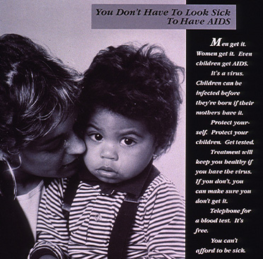 Black and white photograph of a white woman holding a toddler, the toddler is looking at the viewer.    