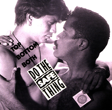 Black and white photograph of a Hispanic man holding a condom and embracing an African American who is slightly lower and looking upwards