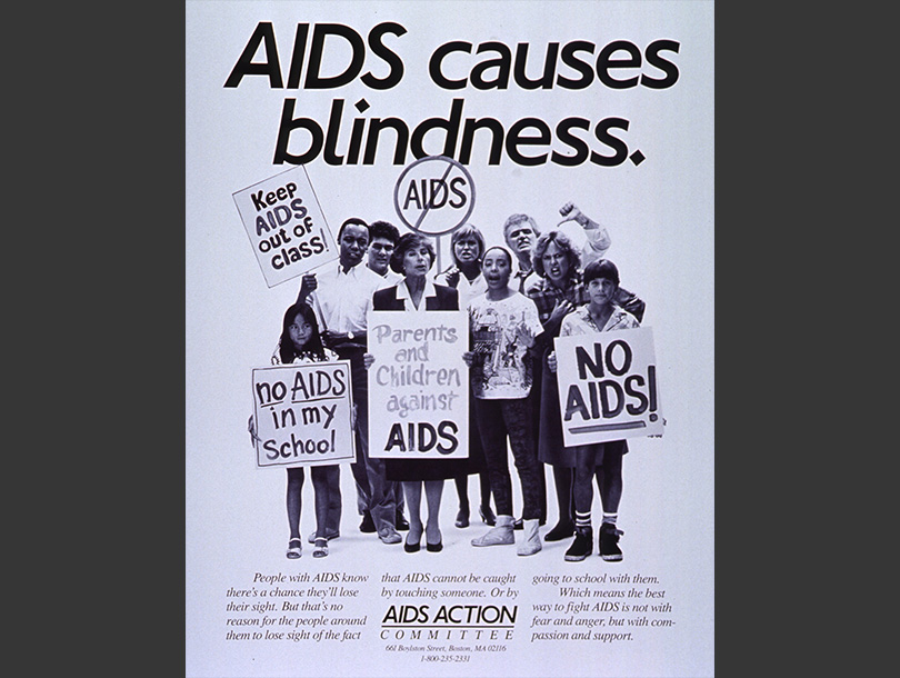 Black and white image of multiracial group of people holding various anti-AIDS signs