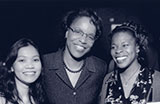 Dr. Joan Y. Reede, an African American woman, center, posing with two women