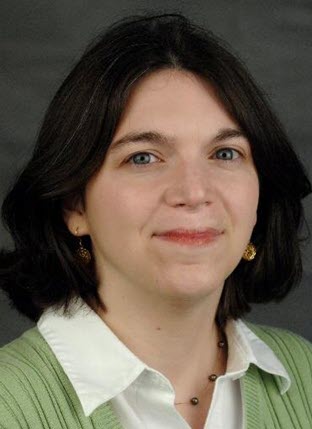 Photograph of a white woman with dark hair.